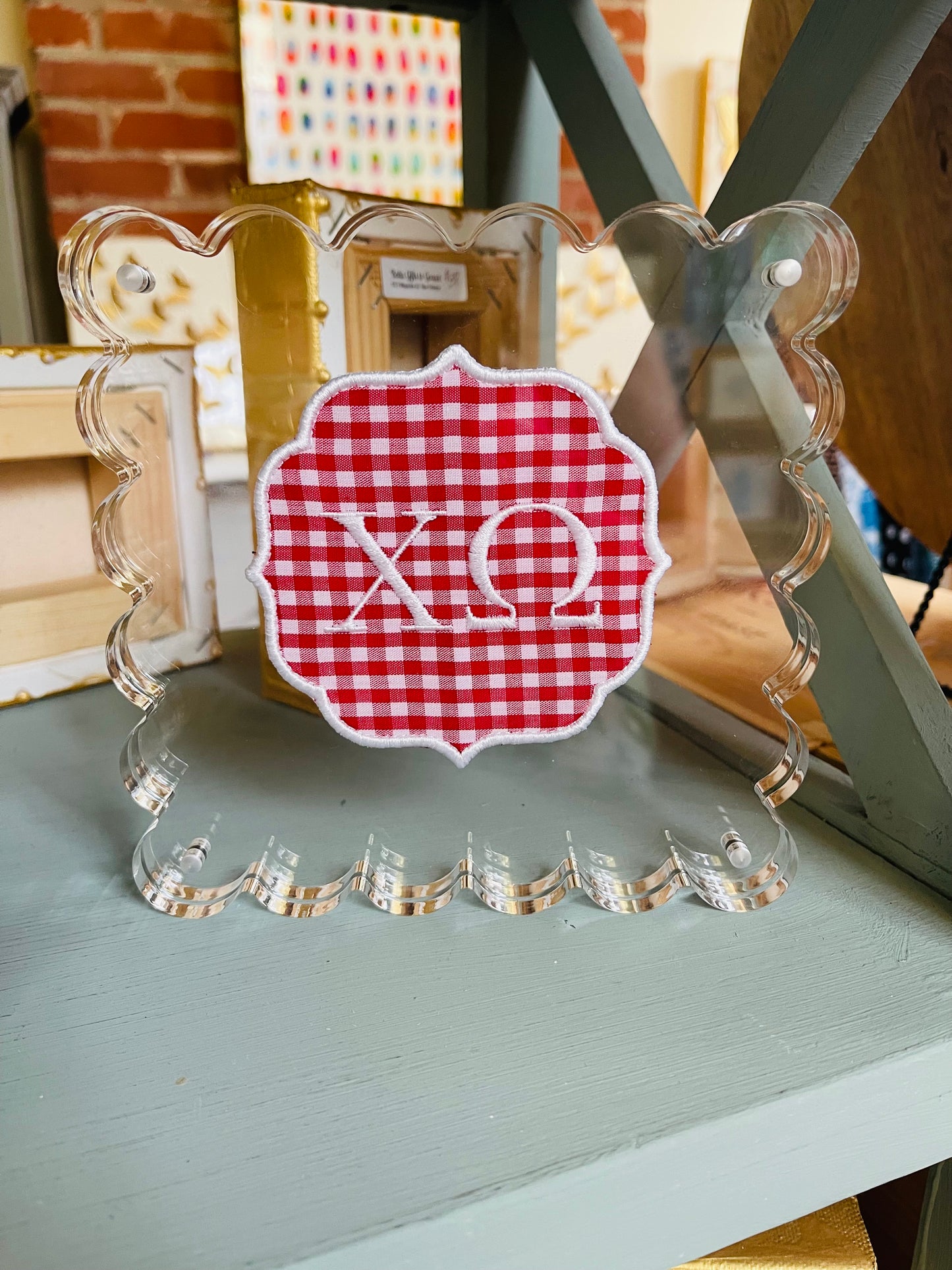 Embroidered Chi Omega on Red Gingham in Scalloped Acrylic Frame