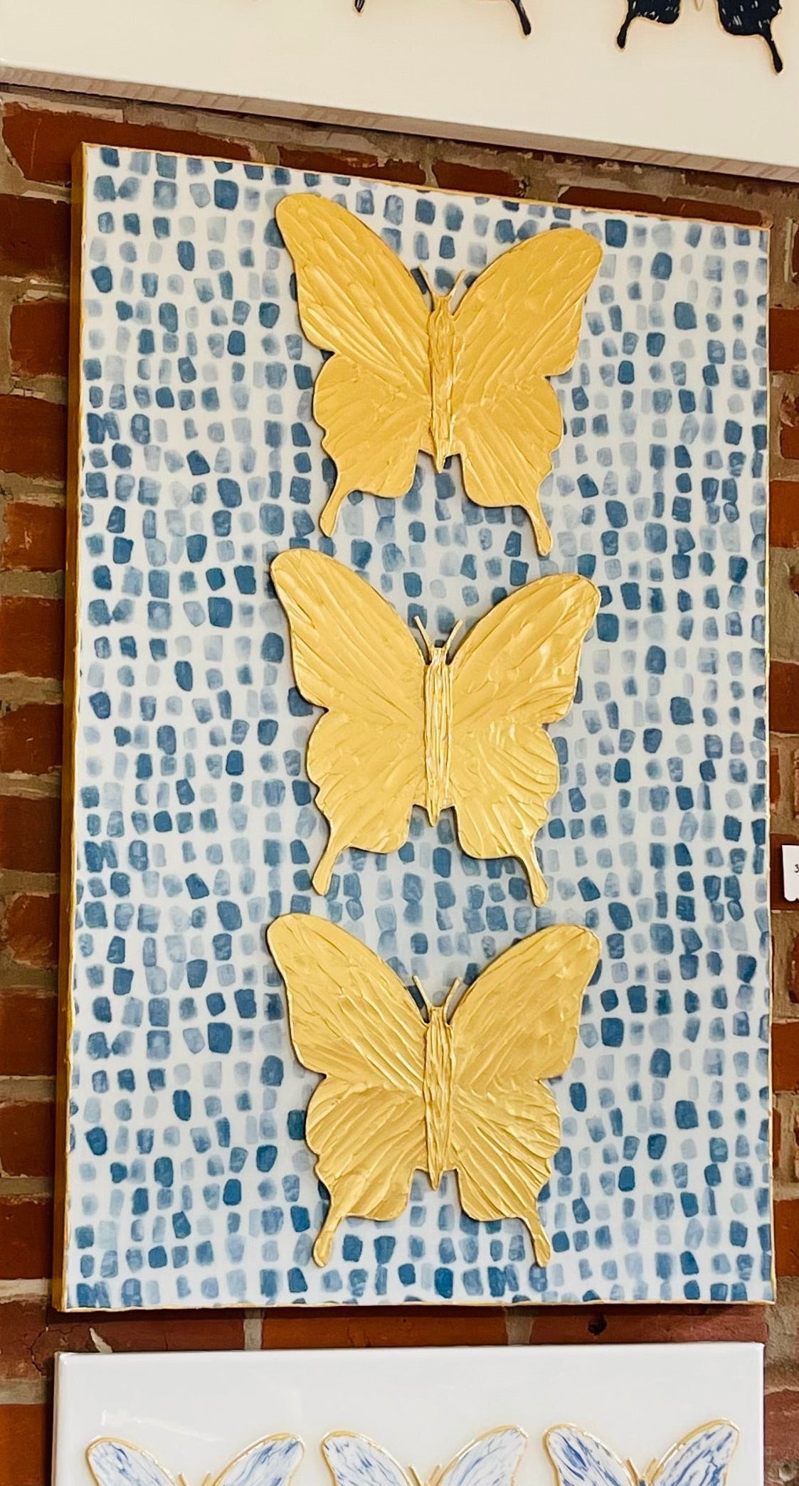 Three Gold Butterflies with Blue/White Background