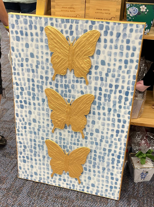 Three Gold Butterflies with Blue/White Background